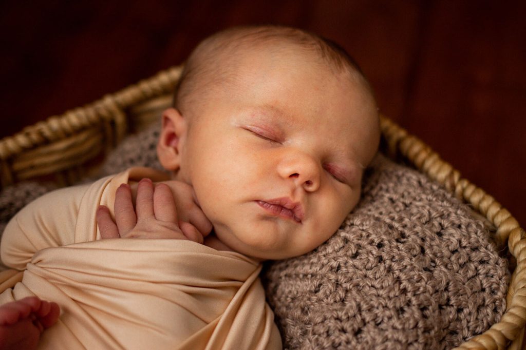 Newborn Baby Sleeping in Basket