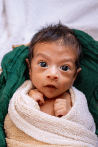 Newborn Baby Wrapped in a Blanket