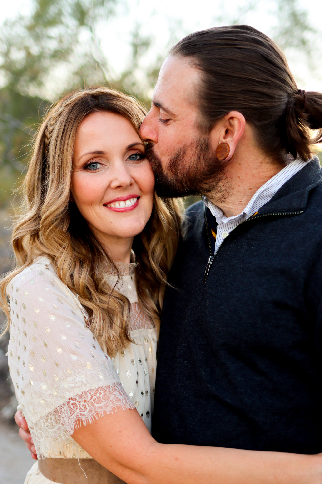 Husband and Wife Hugging Each Other in Family Photo Session