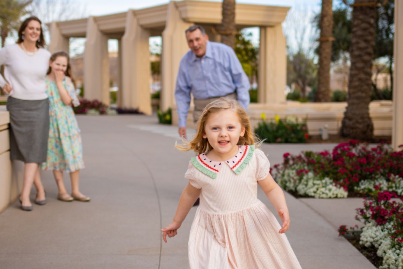 Family of four enjoying a candid photo session in Arizona