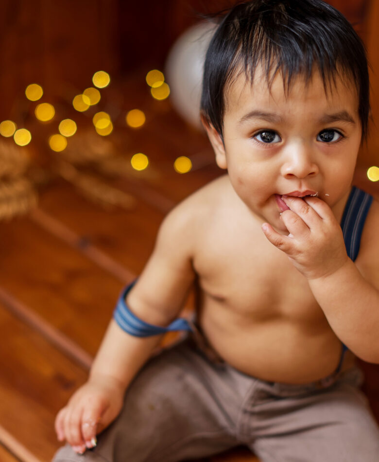First Year Newborn Experience. Baby boy in blue suspenders West Valley Phoenix